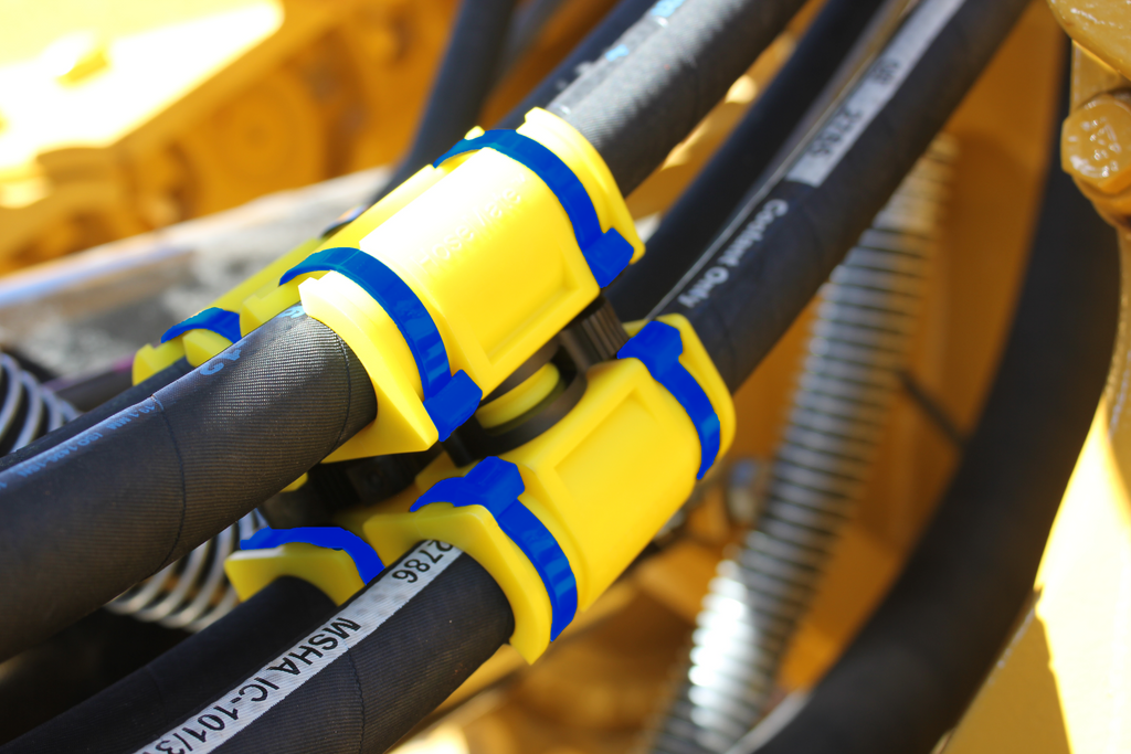 How to protect hydraulic hoses from abrasion